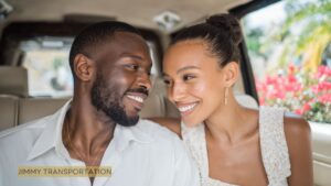 Elegant couple relaxing in the back seat of a luxury chauffeured vehicle in Nassau, enjoying premium comfort and personalized service.